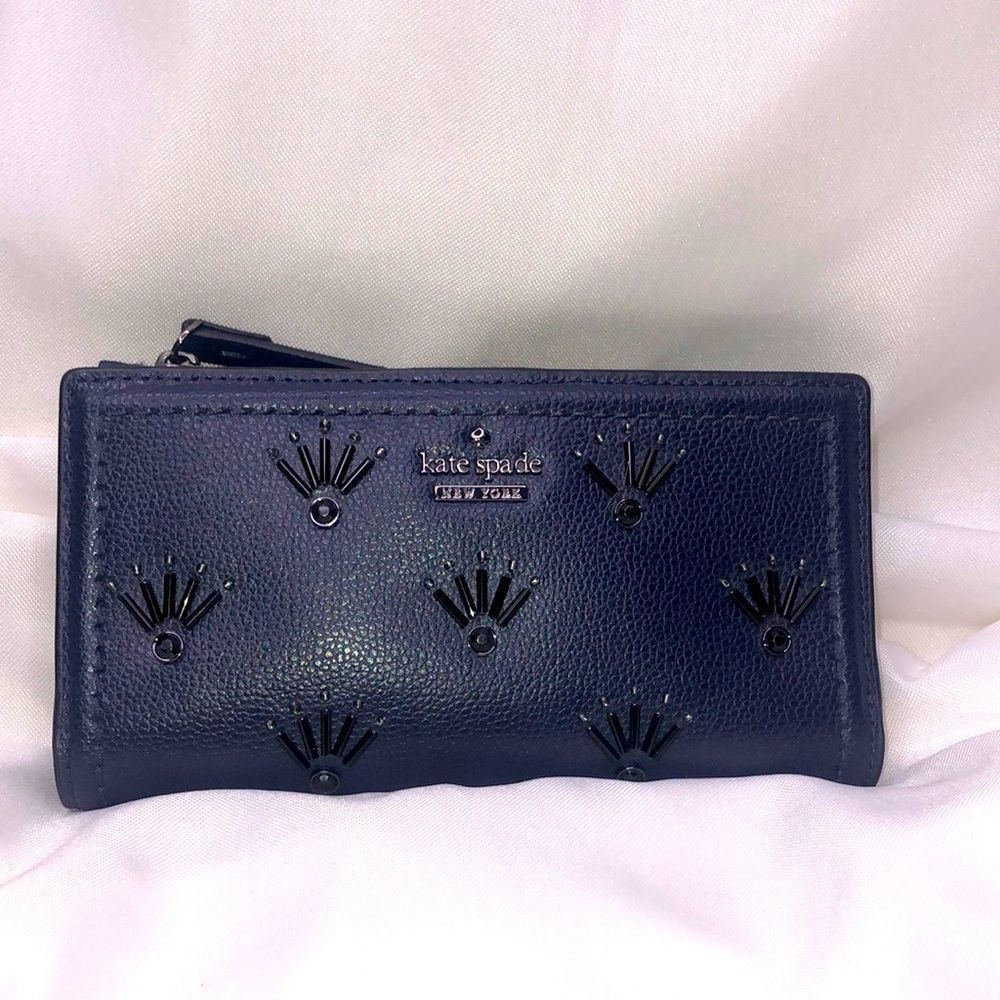 kate spade blue wallet with black 3D eyelash design